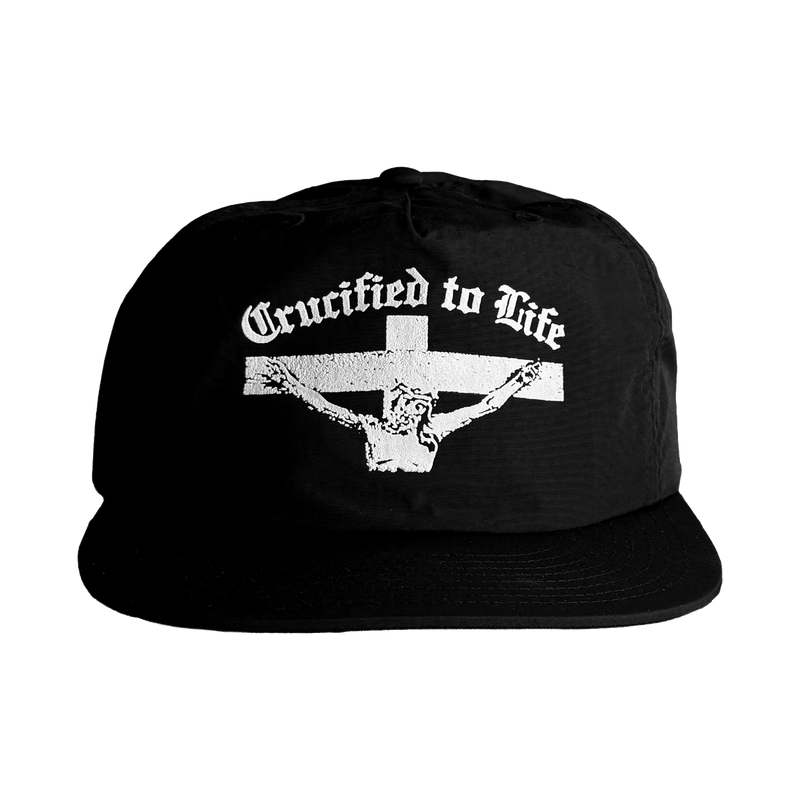 Crucified to Life Christian hat by War Within: black cap with a white screen-printed crucifix, front view