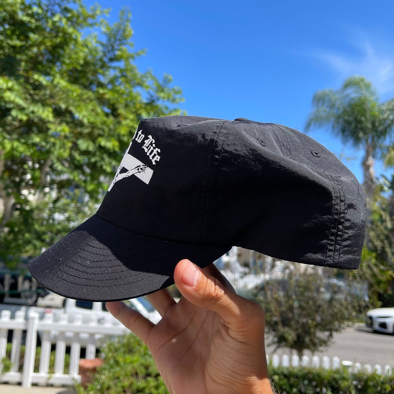 Crucified to Life hat, side profile of the black cap